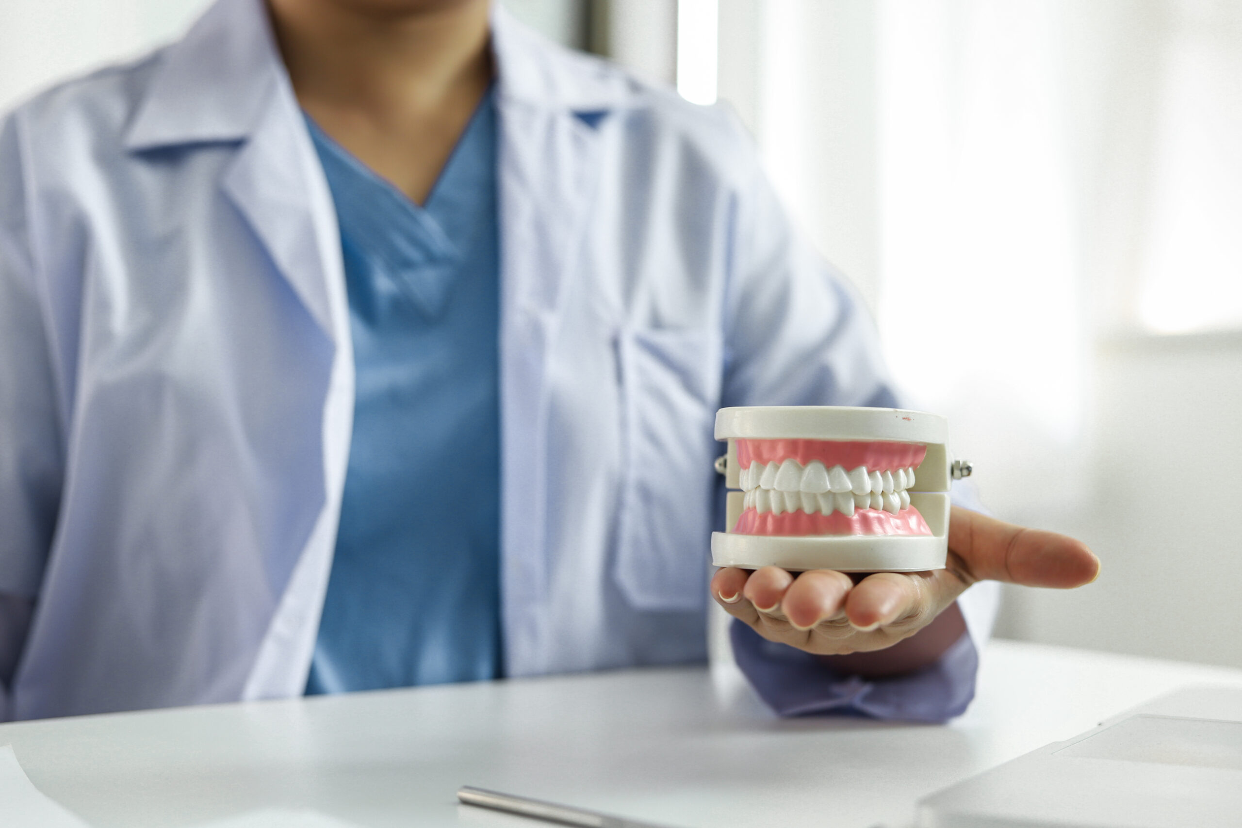 Dentist examining a patient teeth medical treatment at the denta